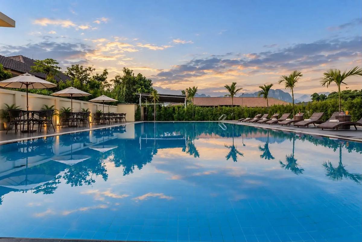 Outdoor swimming pool at sunset